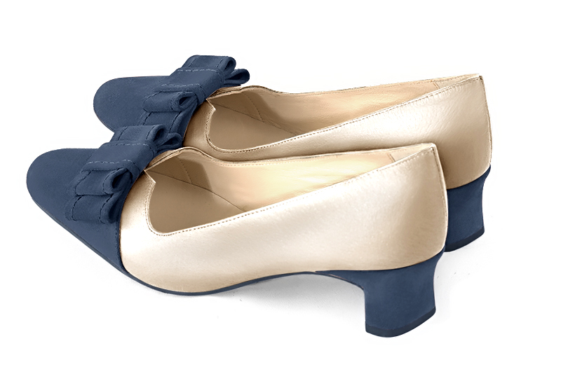 Denim blue and gold women's dress pumps, with a knot on the front. Round toe. Low kitten heels. Rear view - Florence KOOIJMAN